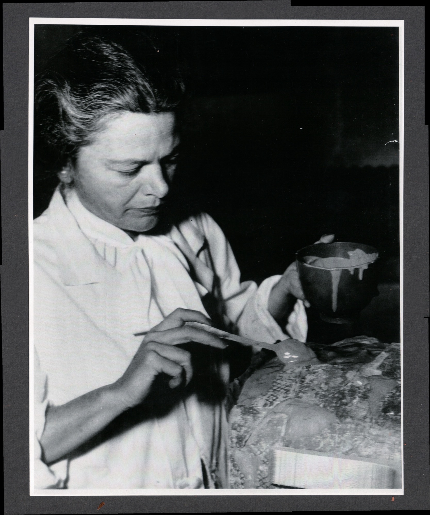 Betty restoring pottery at the Oriental Institute
